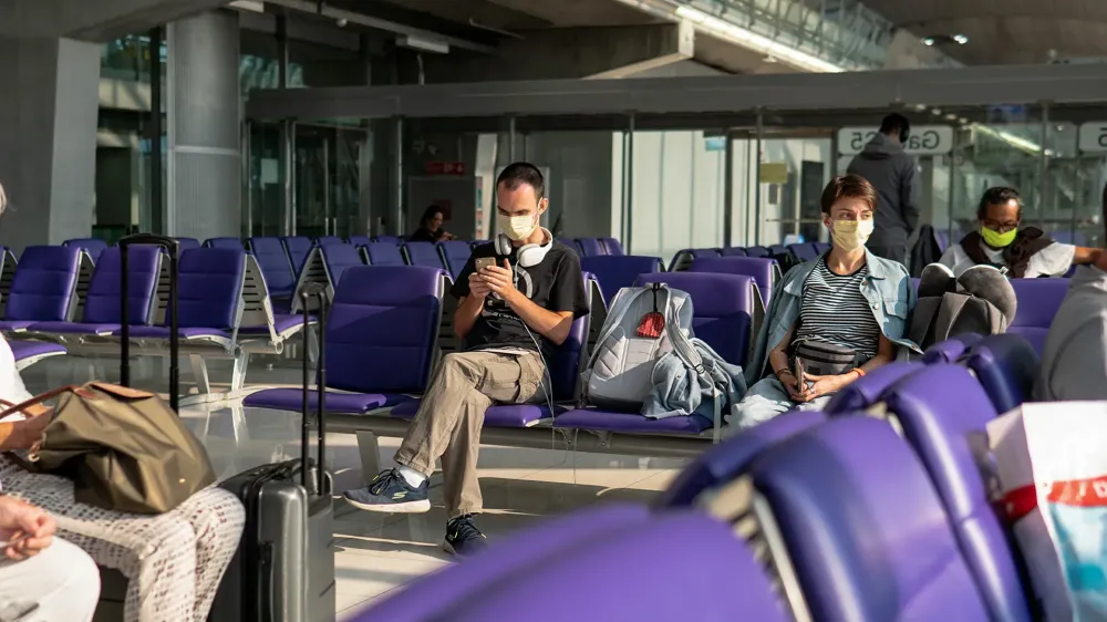 coronavirus pandemic COVID-19 in airports. Quarantine and protective measures to stop the spread of the virus around the world.
